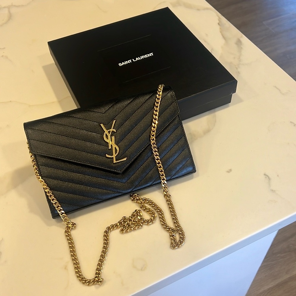 Beautiful great condition YSL black bag with gold chain .